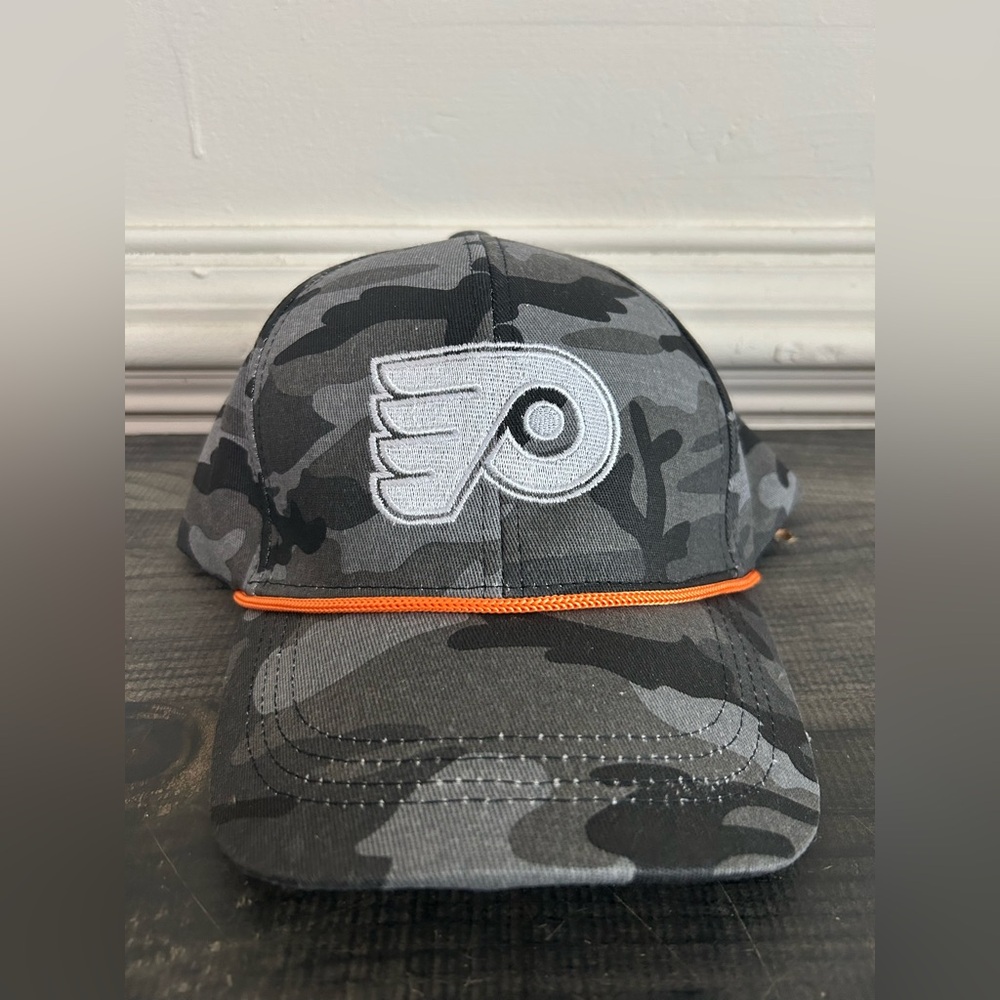 Camouflage Philadelphia Flyers hat with Orange Trim